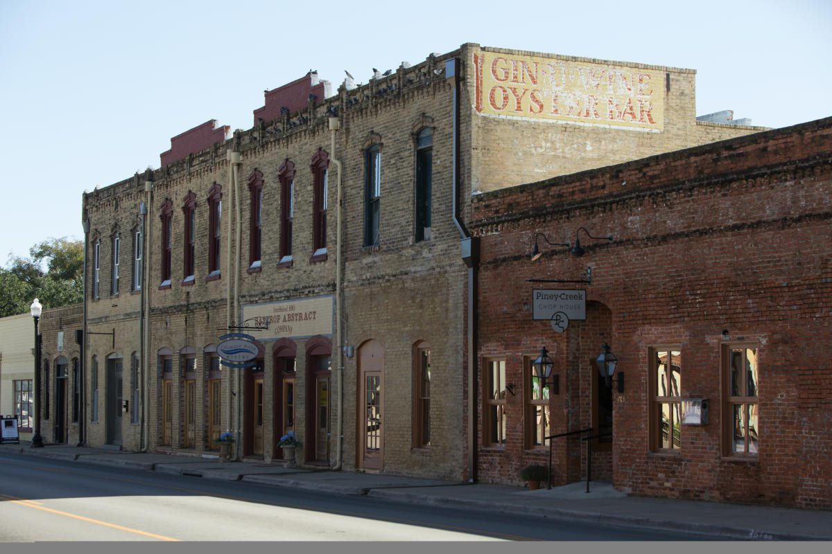 Historic brick storefronts in downtown Bastrop, Texas