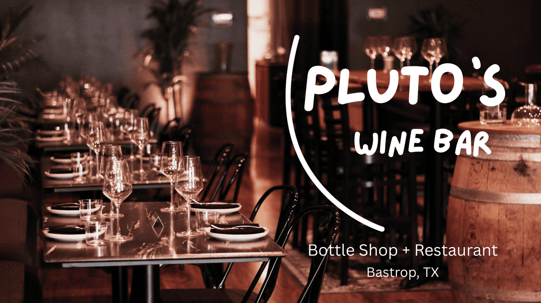 Pluto’s Wine Bar promotional image showing dining tables set with wine glasses